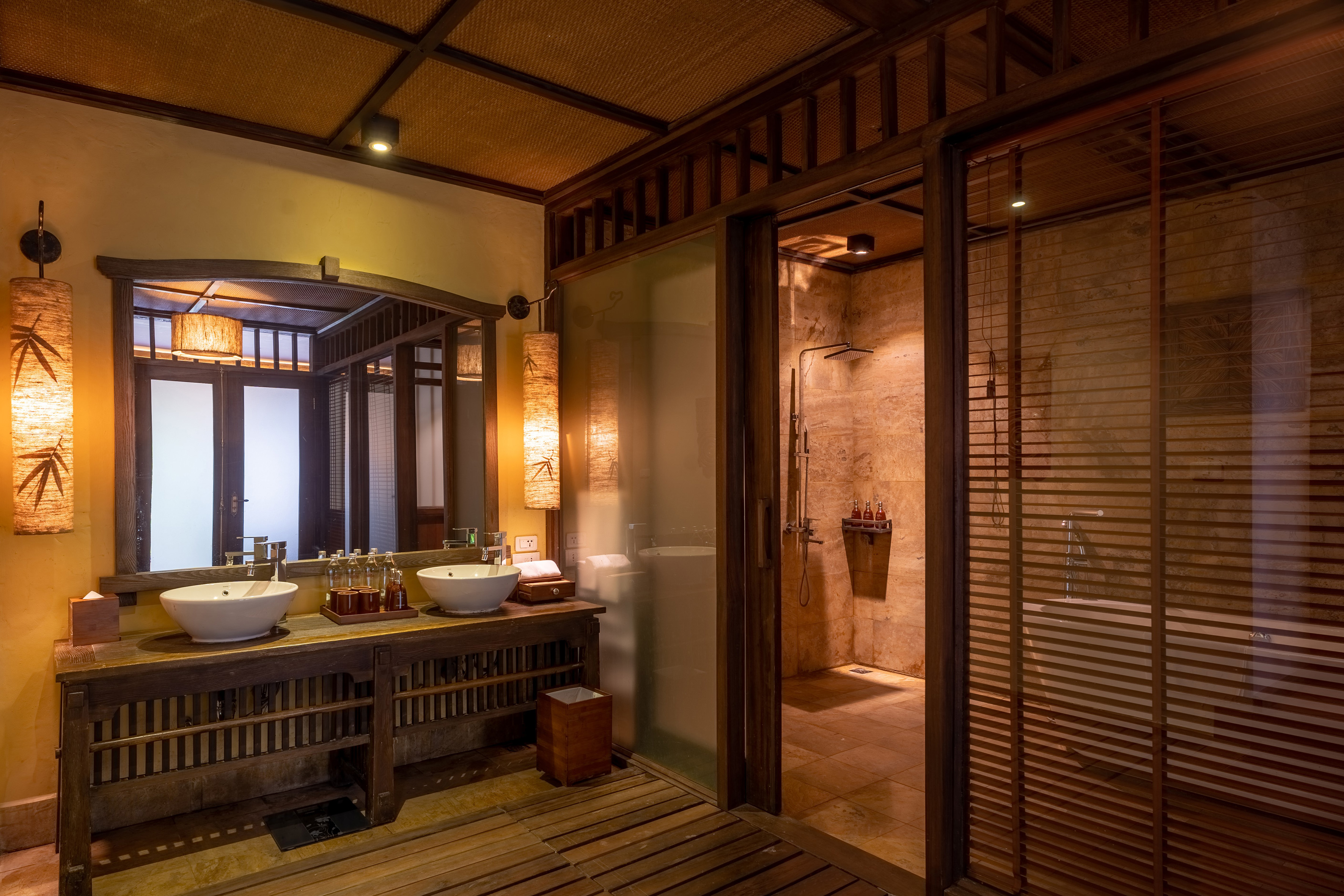 a bathroom with a shower and sinks