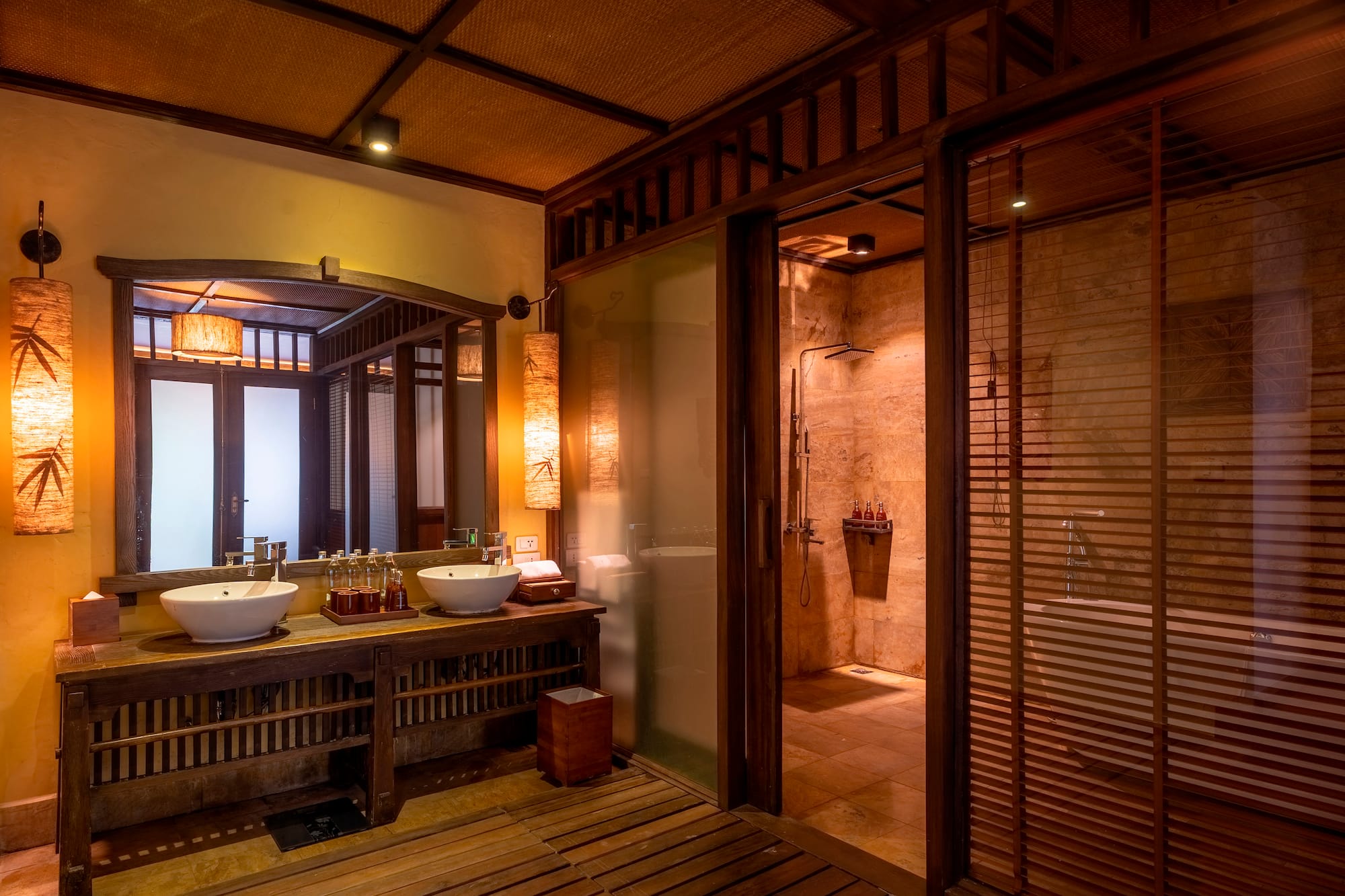 a bathroom with a shower and sinks