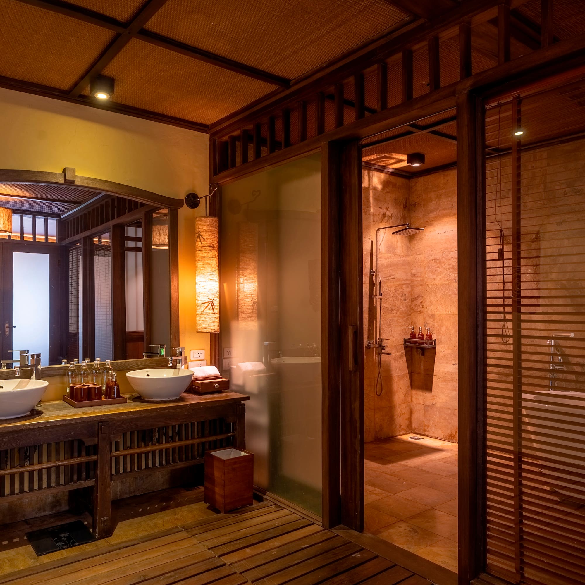 a bathroom with a shower and sinks
