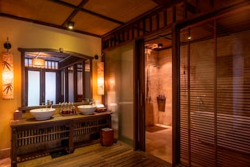 a bathroom with a shower and sinks