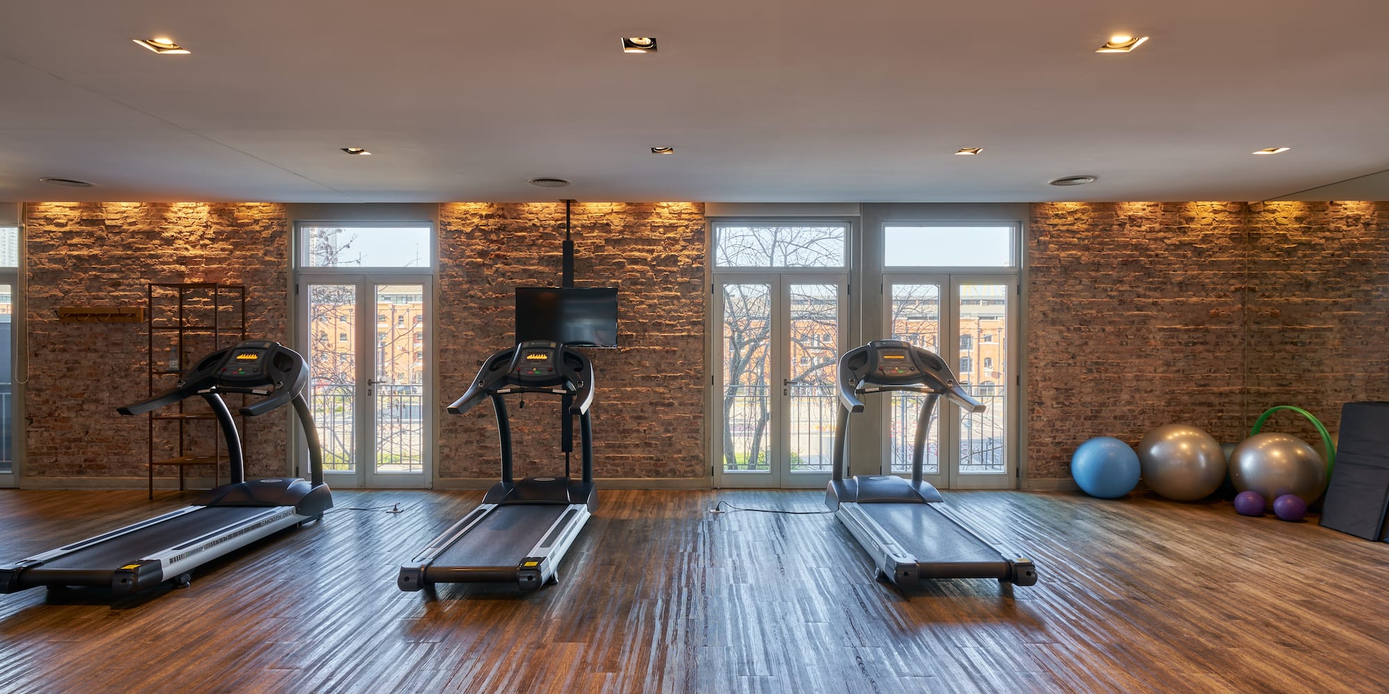 a gym with treadmills and exercise balls