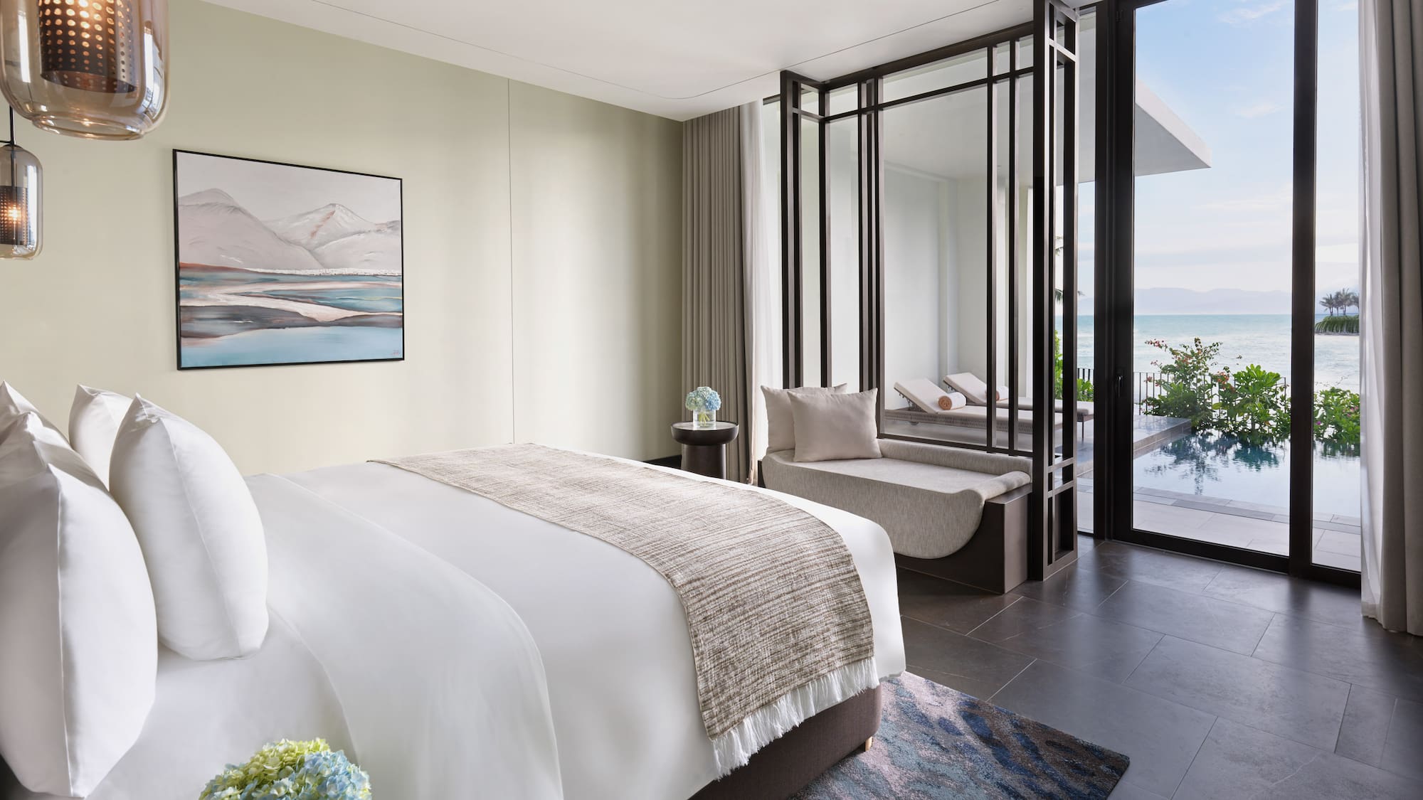 a bedroom with a view of the ocean