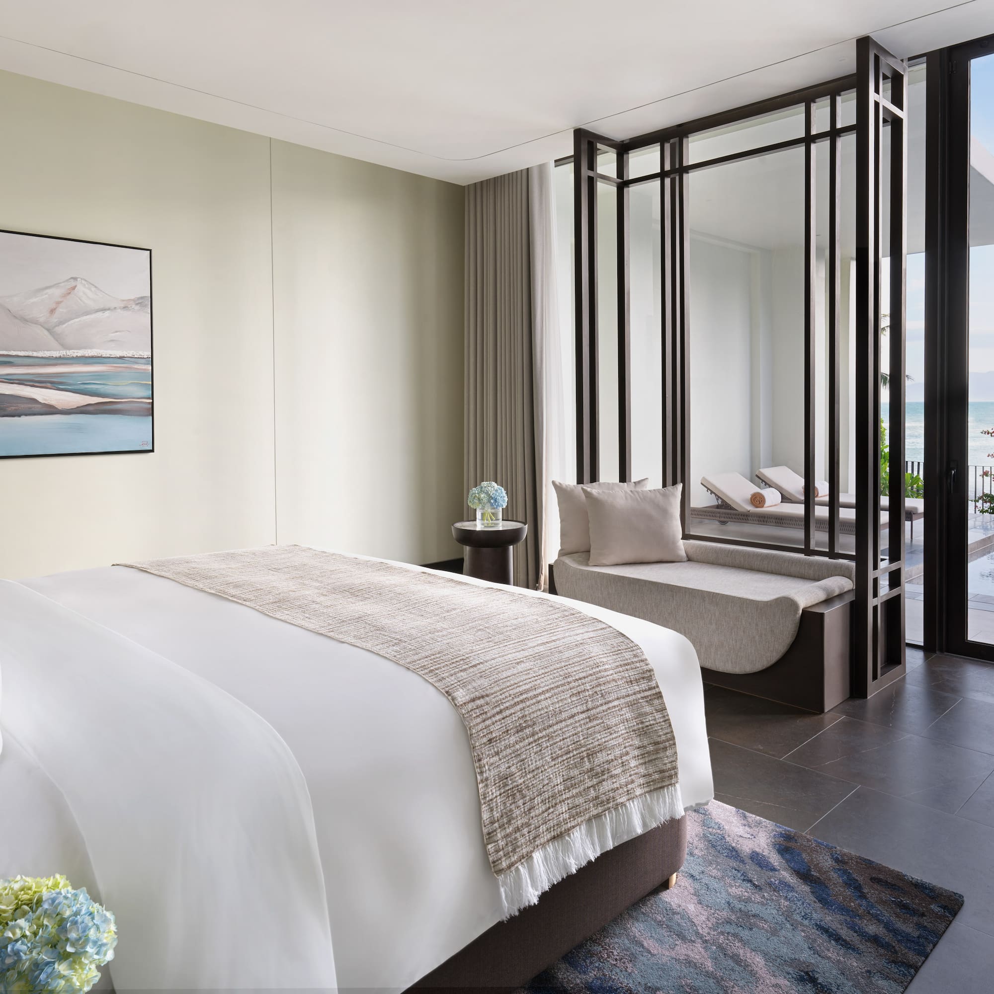 a bedroom with a view of the ocean