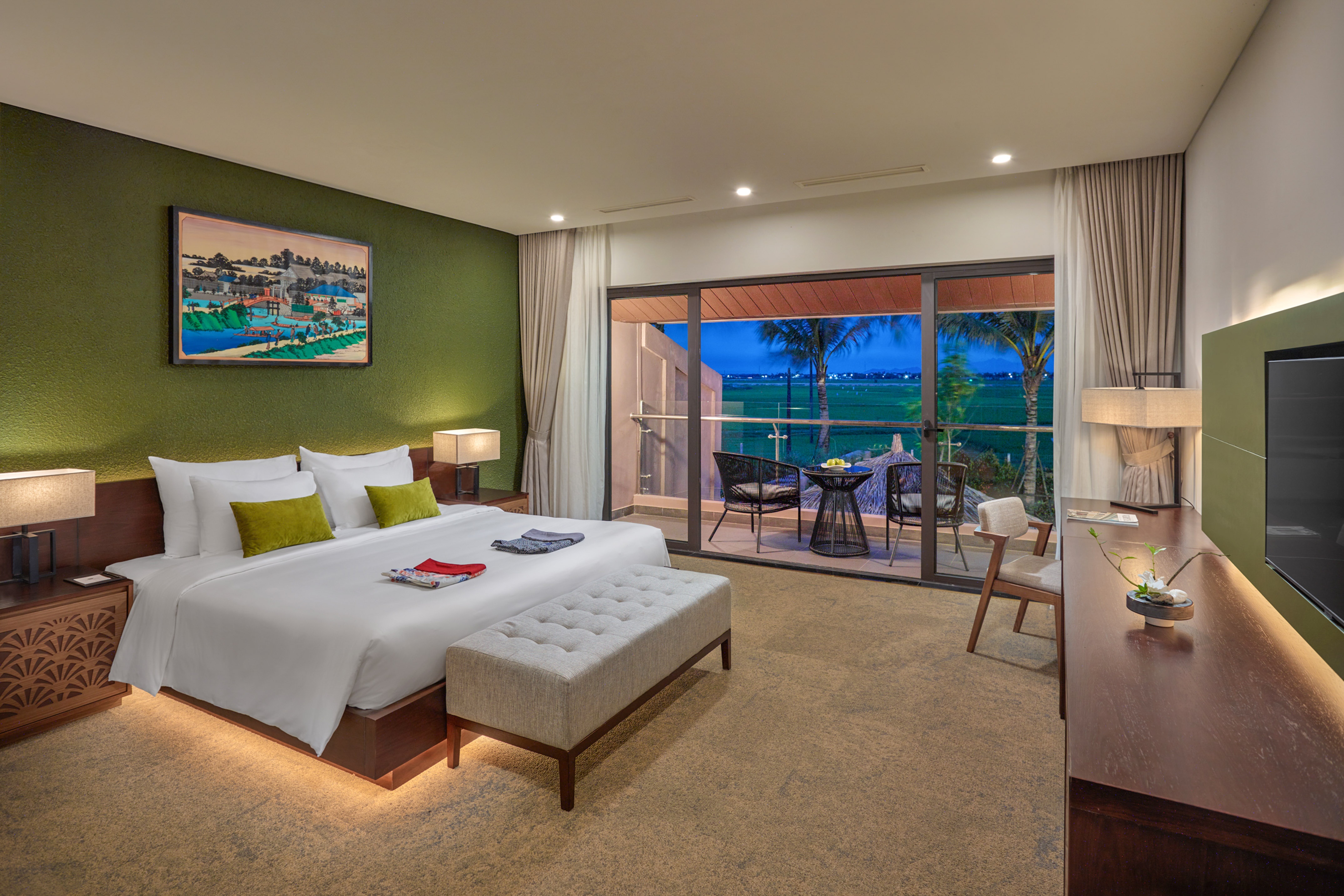 a bedroom with a glass door and a bed