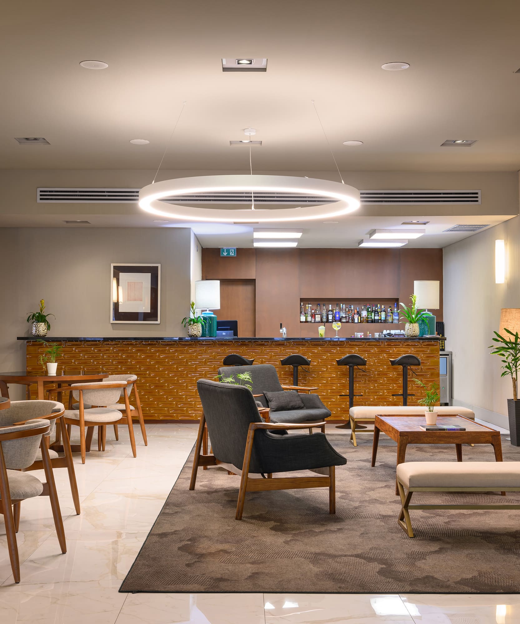 a room with chairs and a bar