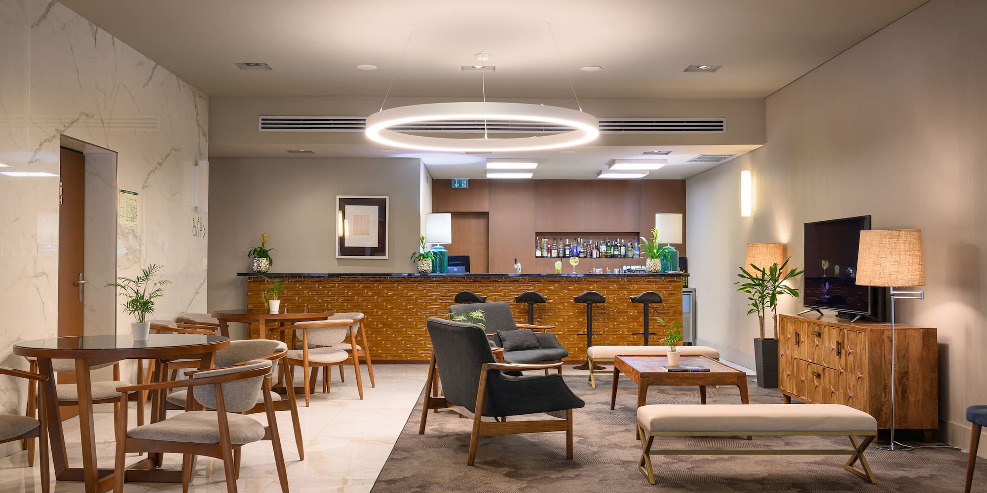 a room with chairs and a bar