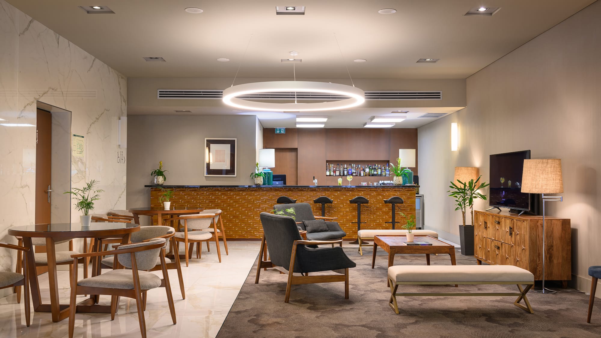 a room with chairs and a bar