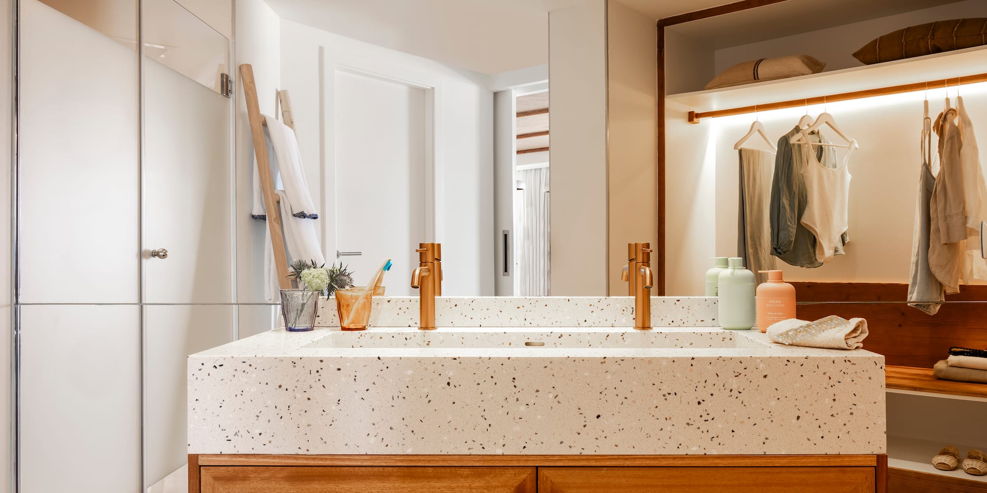 a bathroom with a double sink and shower