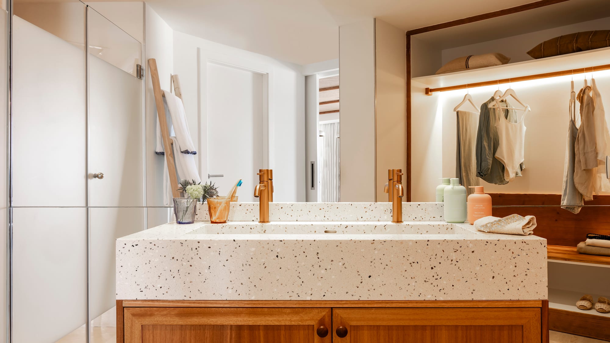 a bathroom with a double sink and shower