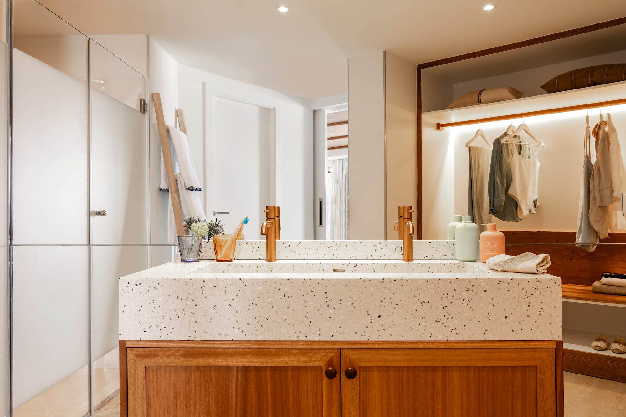 a bathroom with a double sink and shower