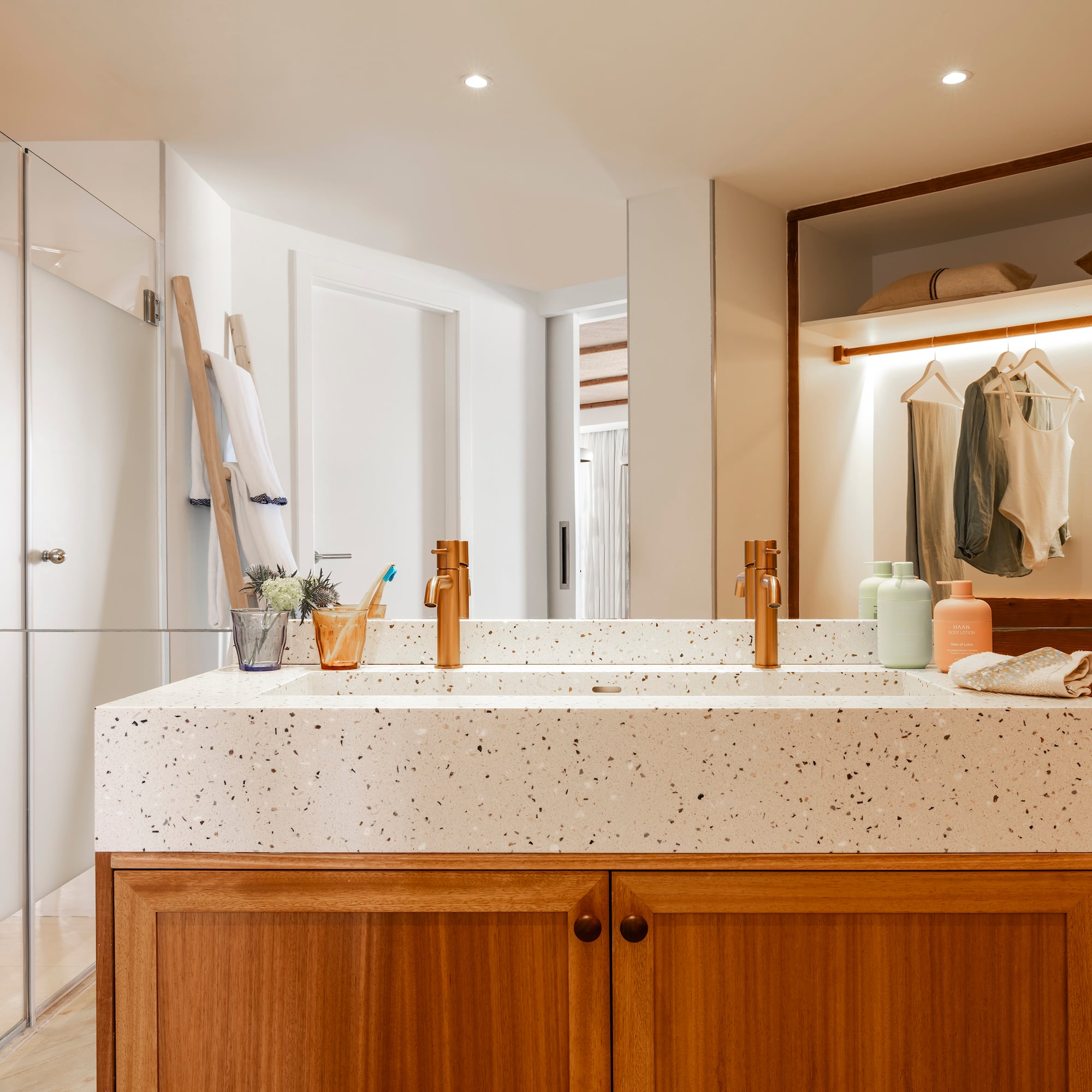 a bathroom with a double sink and shower