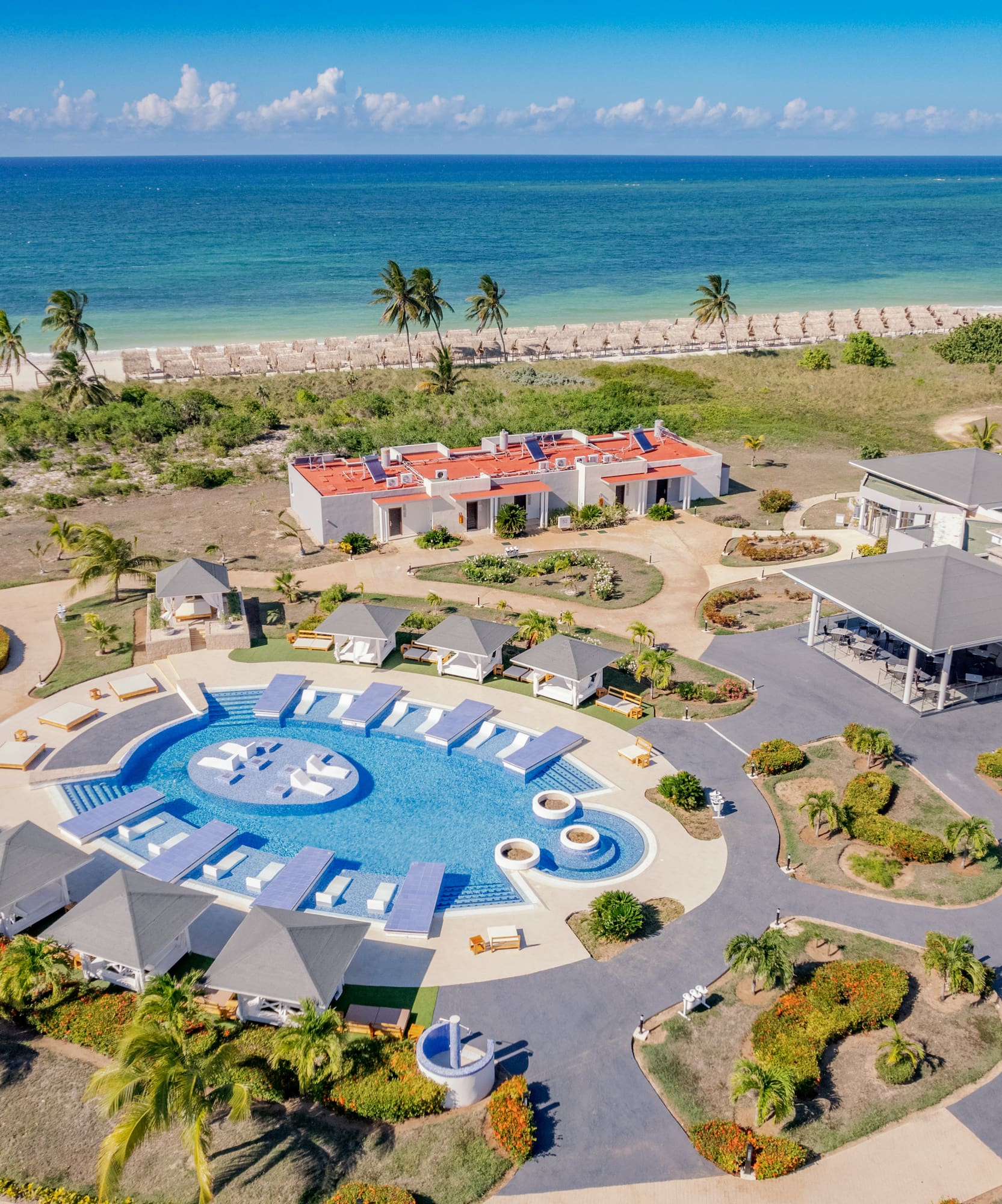 a resort with a pool and a beach