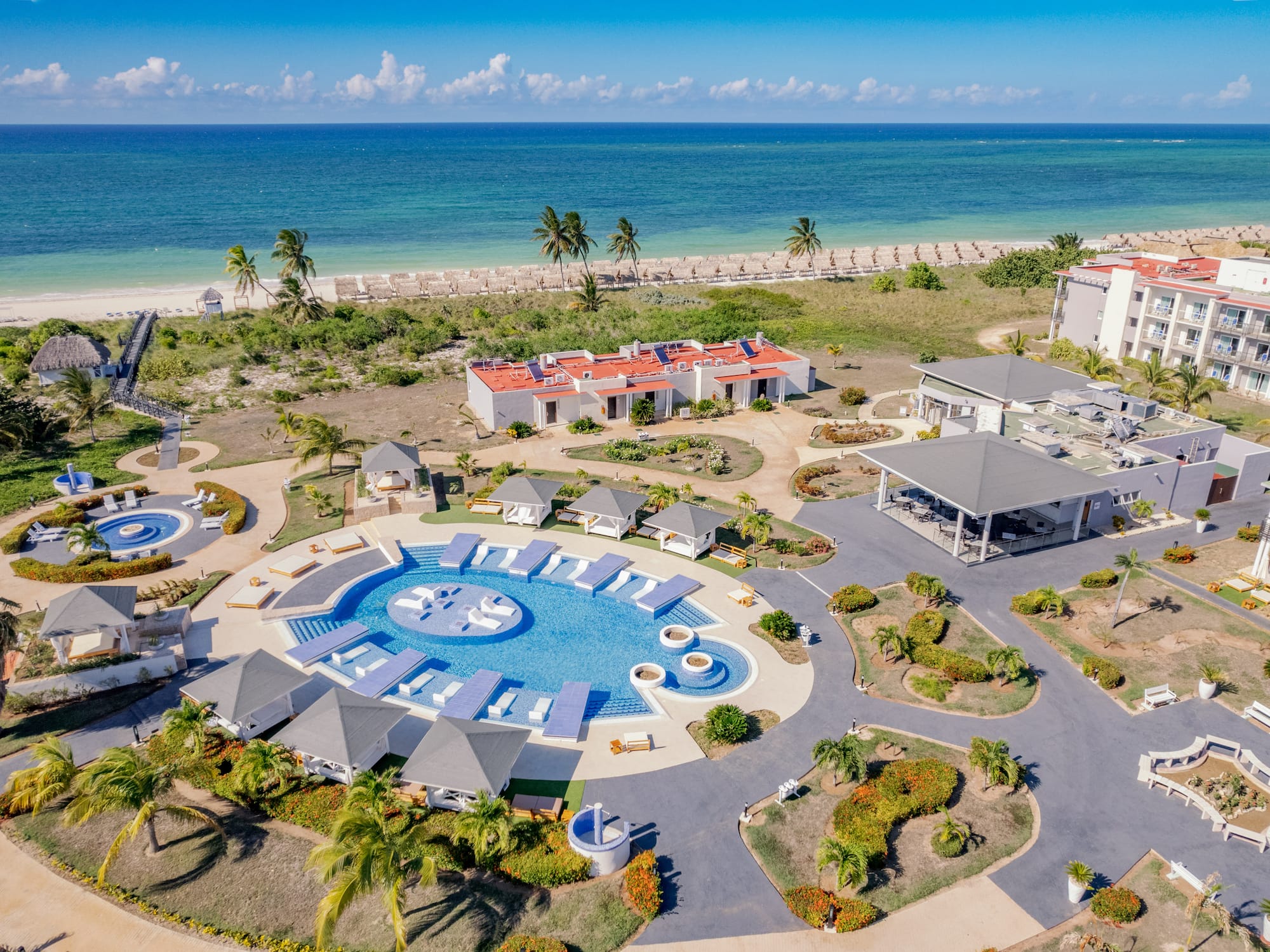 a resort with a pool and a beach
