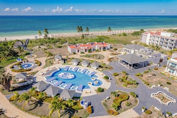 a resort with a pool and a beach