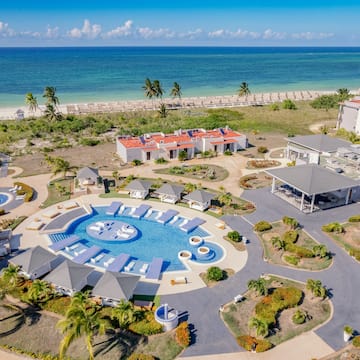 a resort with a pool and a beach