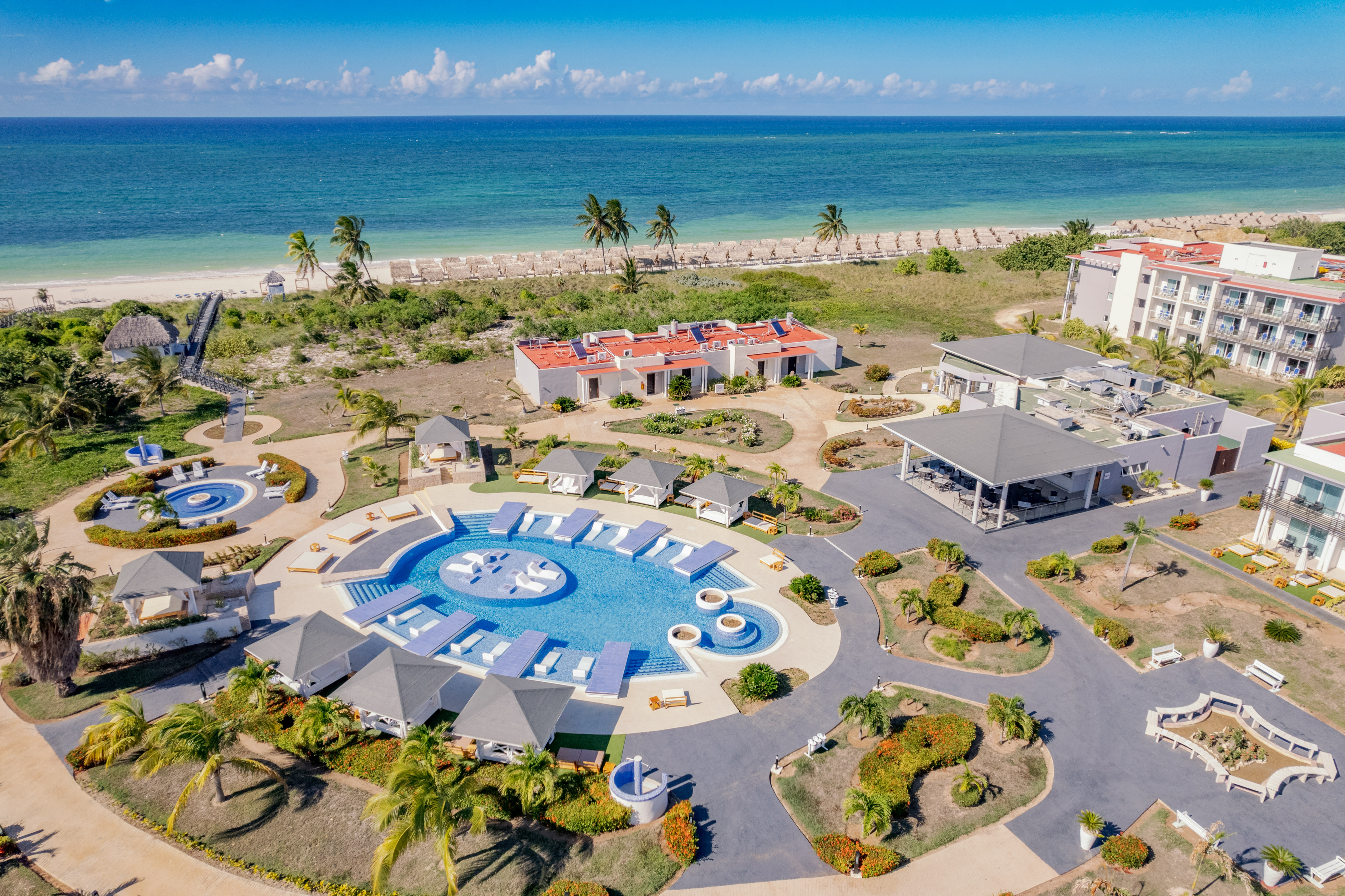 a resort with a pool and a beach