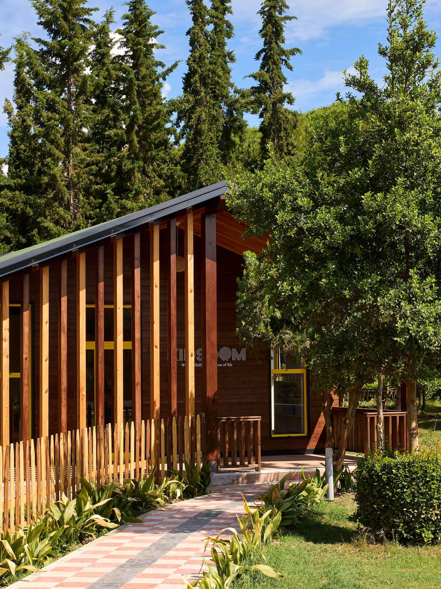 a house with a fence and trees