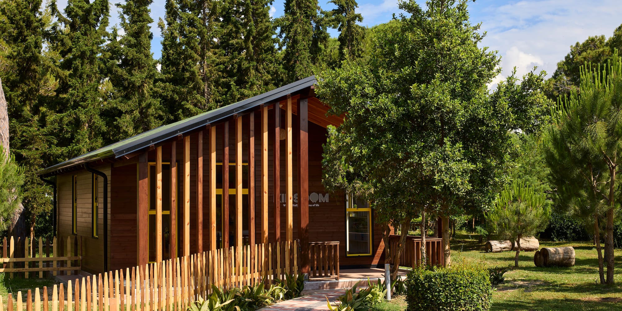 a house with a fence and trees