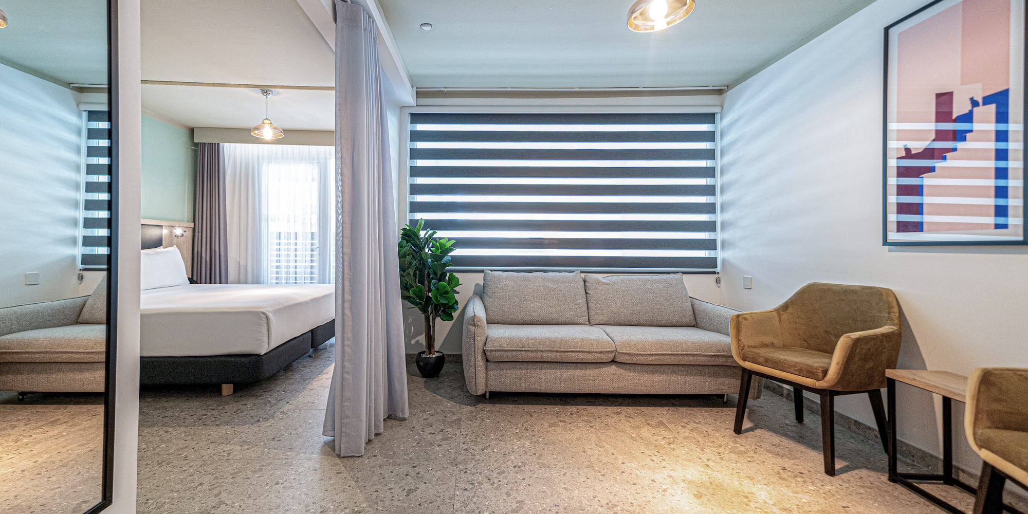 a room with a couch and a sofa