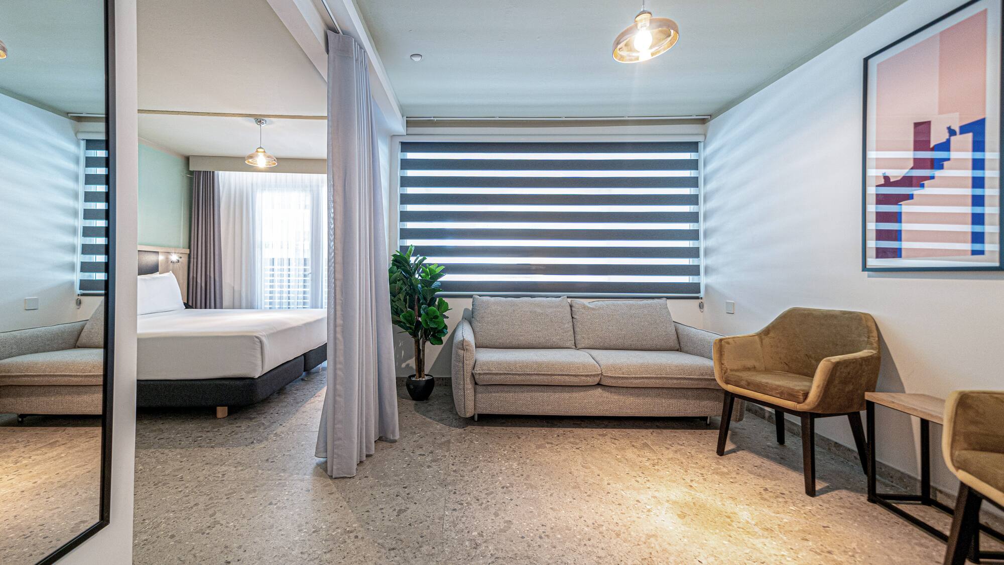 a room with a couch and a sofa
