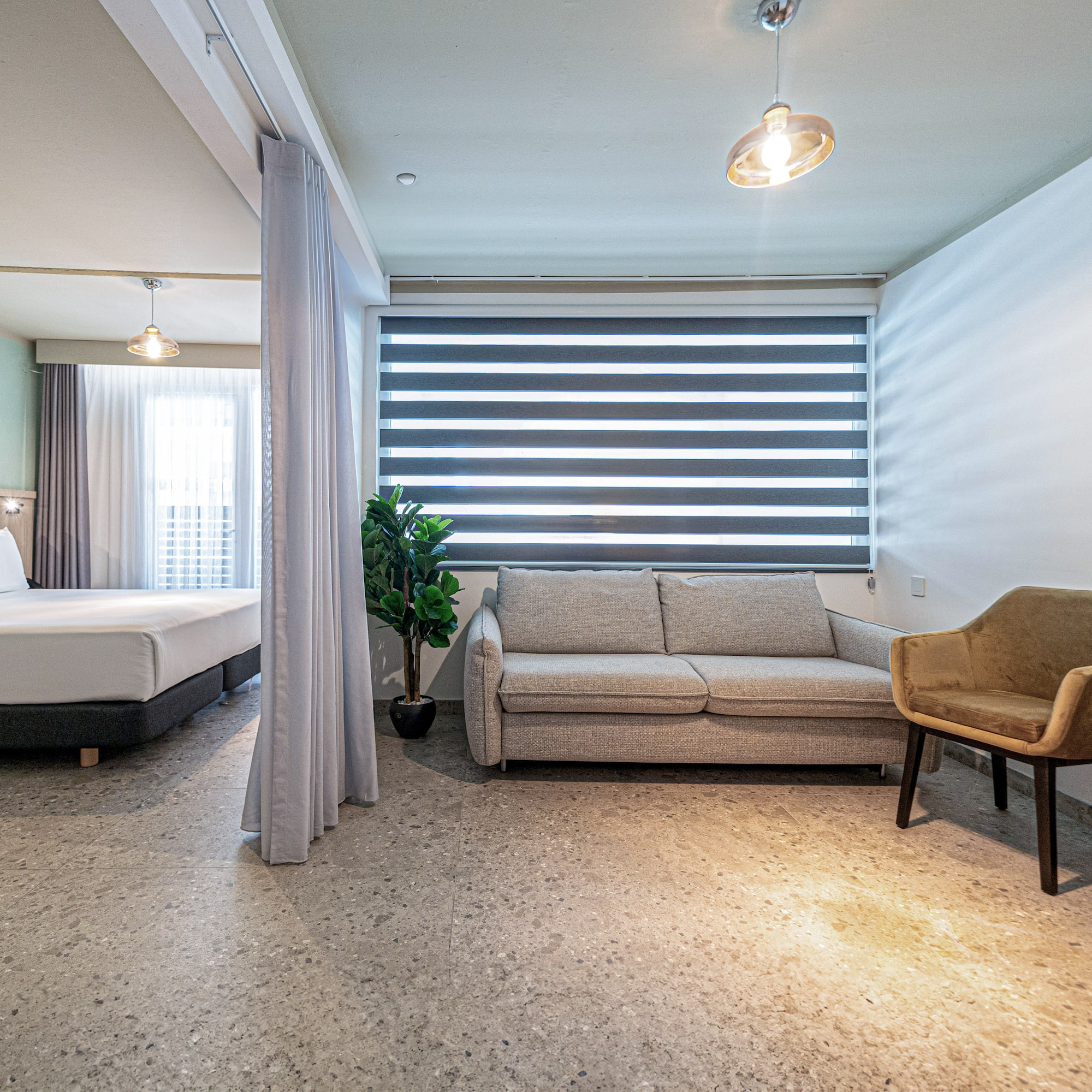 a room with a couch and a sofa