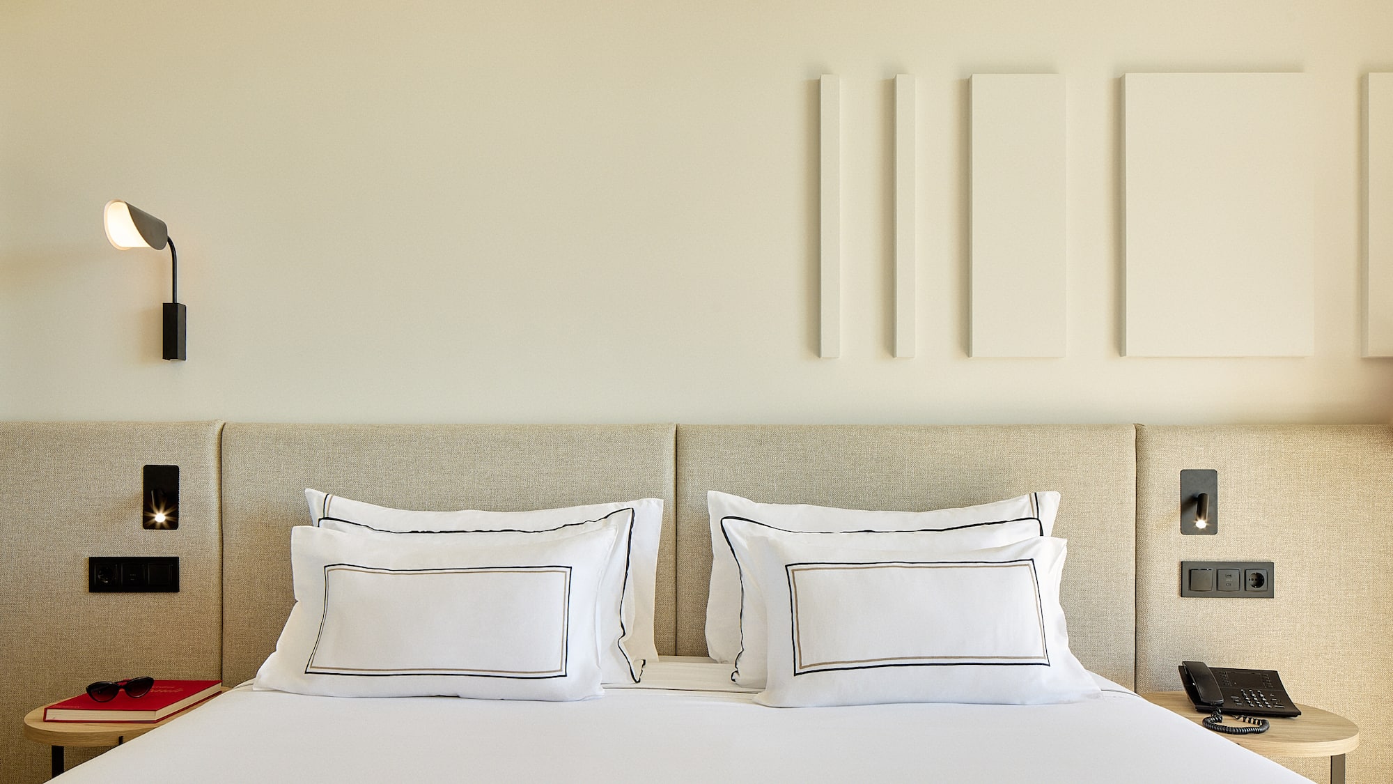 a bed with white pillows