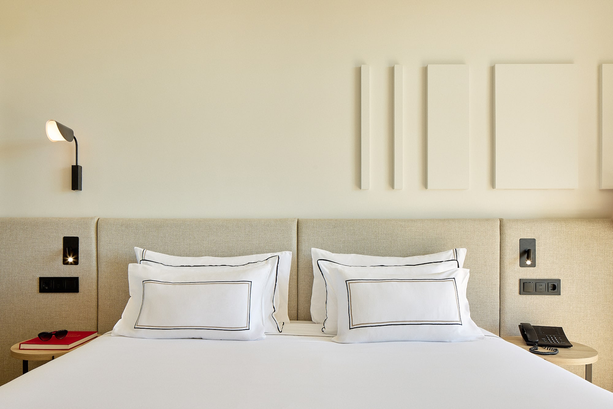 a bed with white pillows