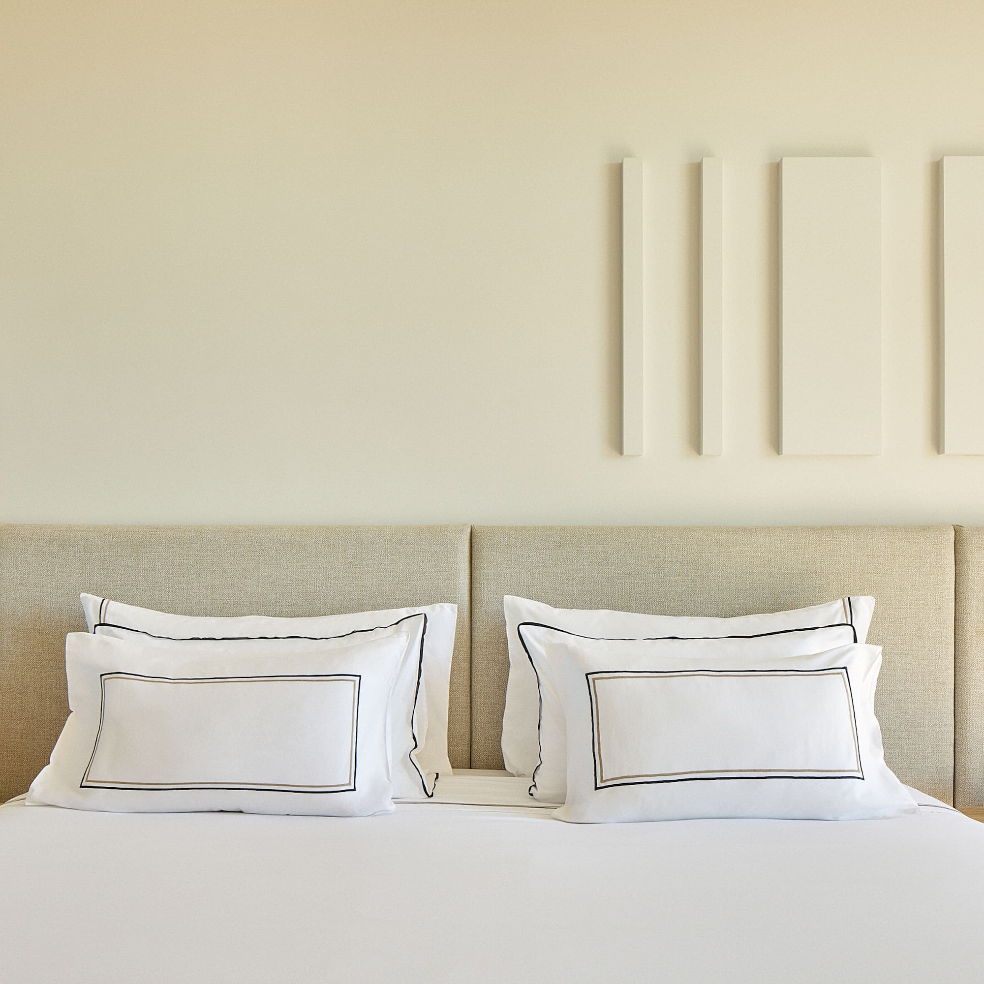 a bed with white pillows