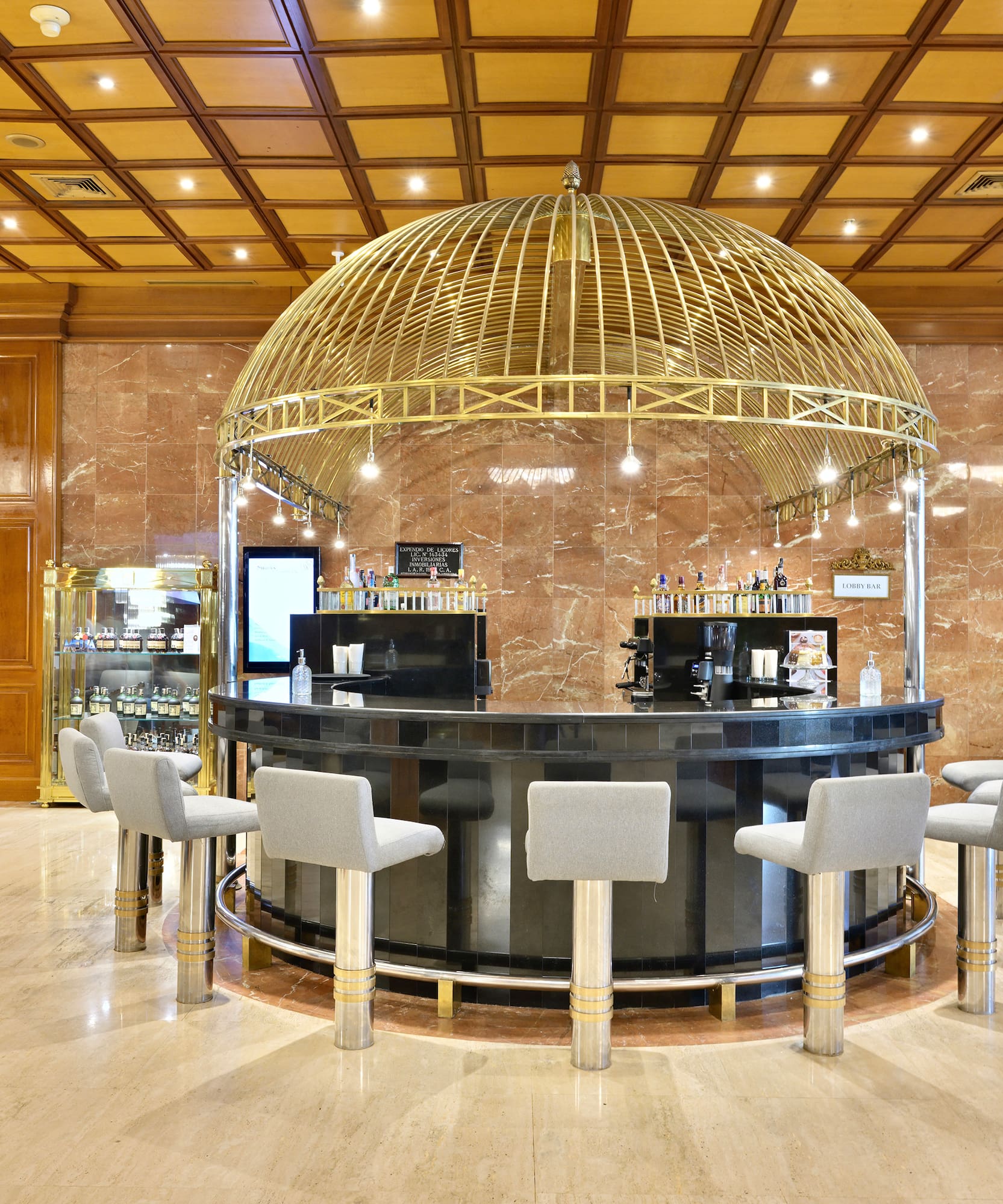 a bar with a dome top and chairs in a room