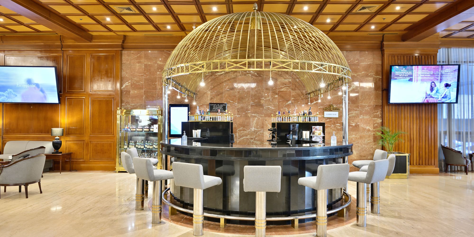 a bar with a dome top and chairs in a room