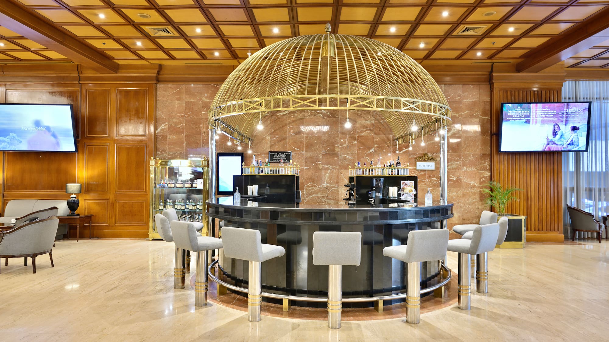a bar with a dome top and chairs in a room