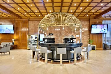 a bar with a dome top and chairs in a room
