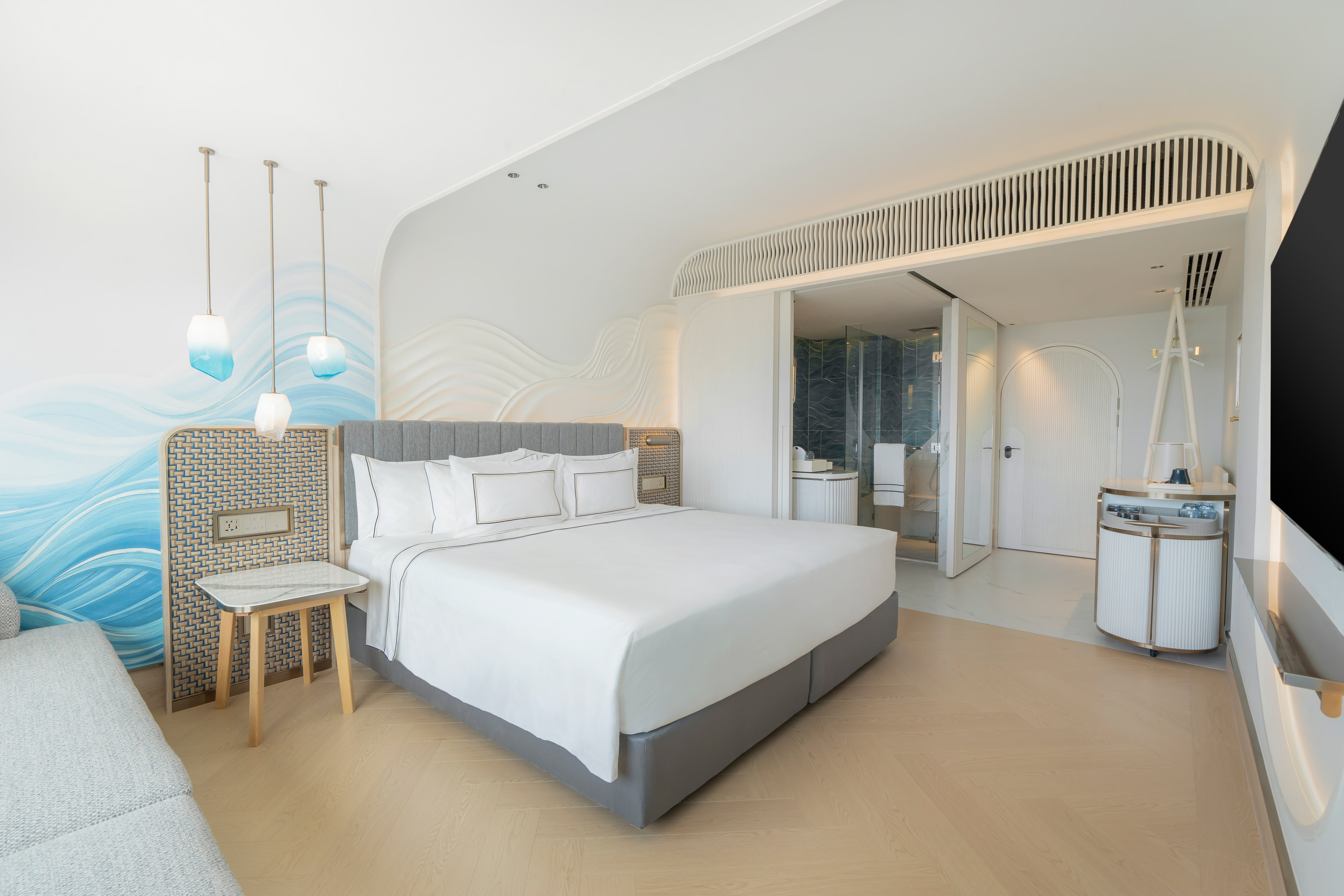 a bedroom with a bed and a sink