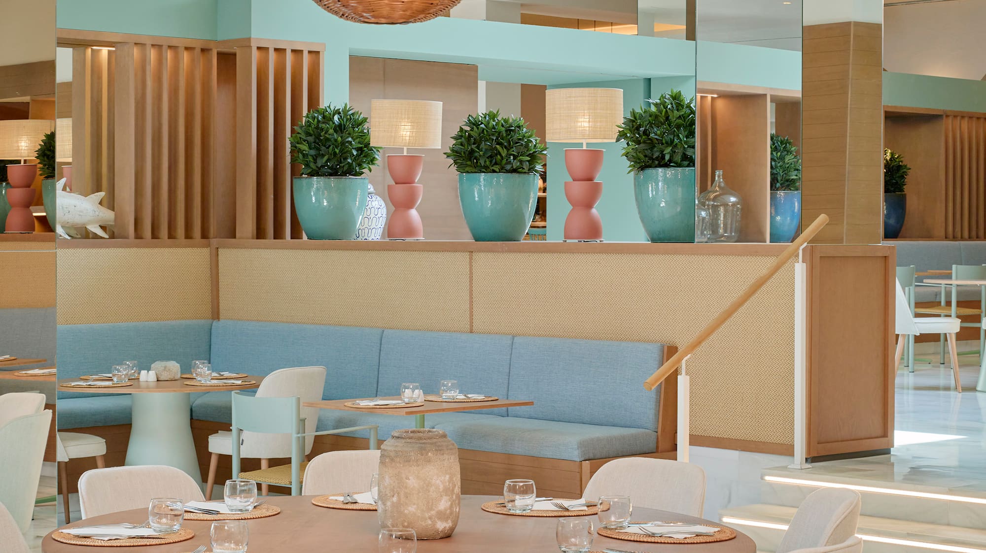 a restaurant with a large table and chairs