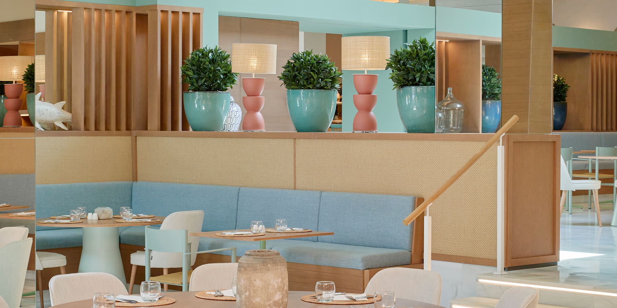 a restaurant with a large table and chairs