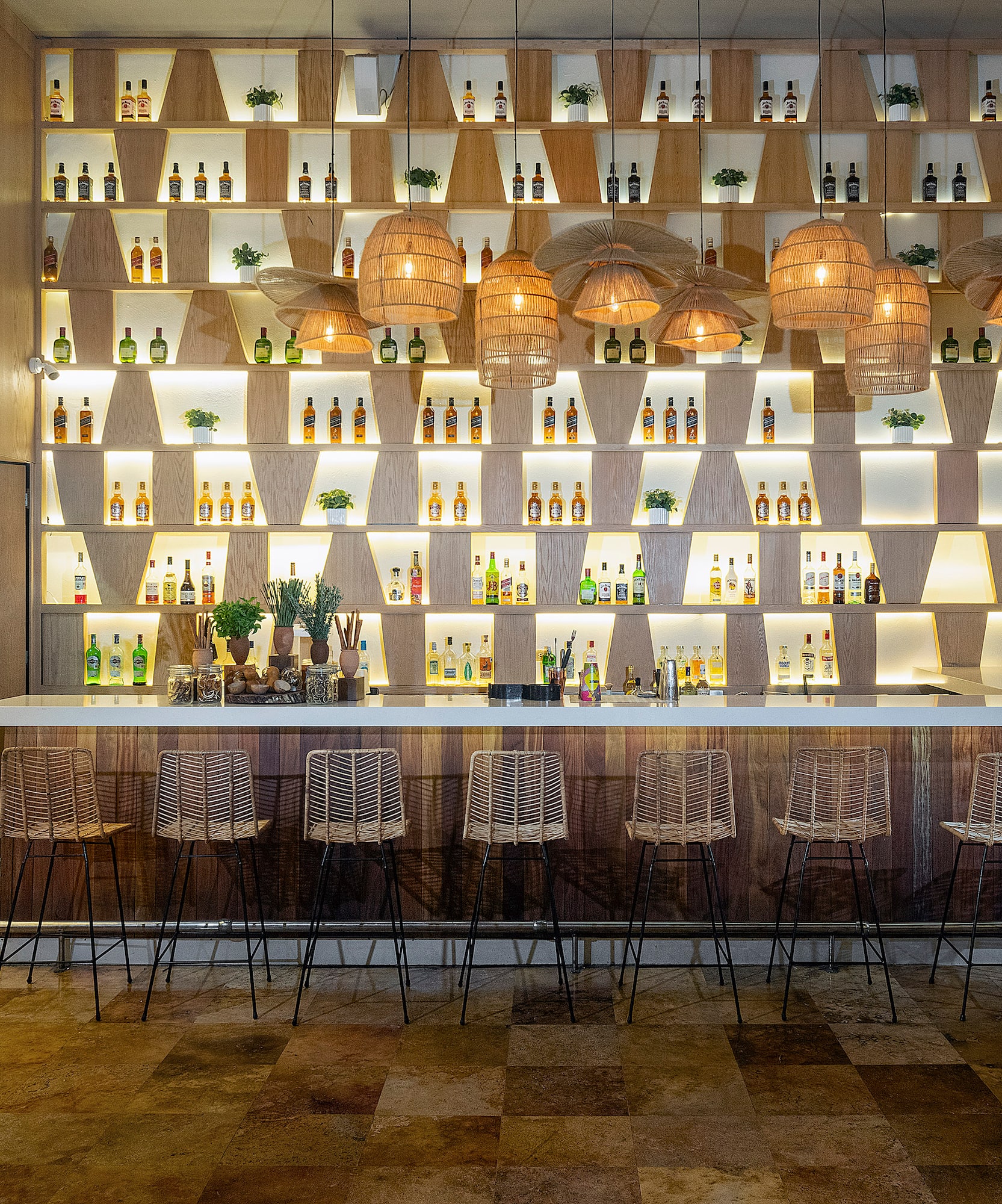 a bar with bottles of liquor on the wall