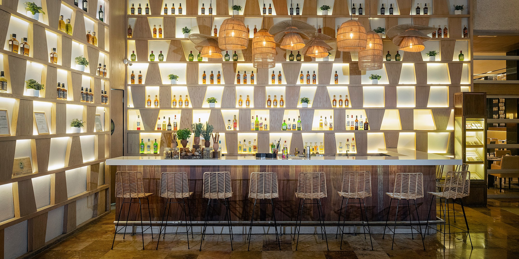 a bar with bottles of liquor on the wall