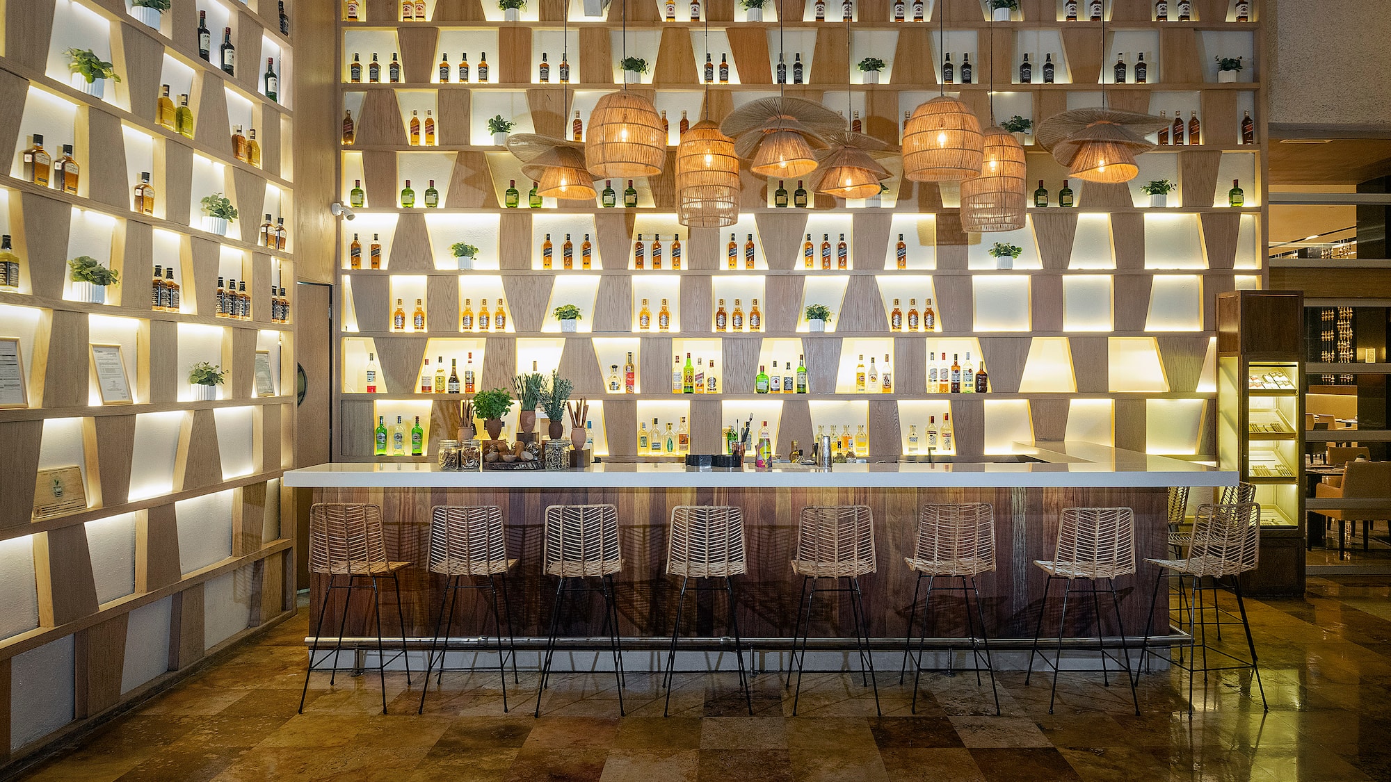 a bar with bottles of liquor on the wall