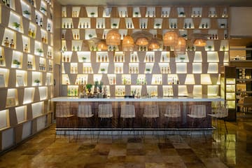 a bar with bottles of liquor on the wall