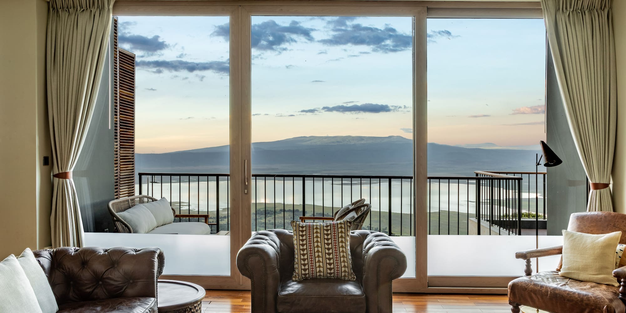 a living room with a view of the ocean