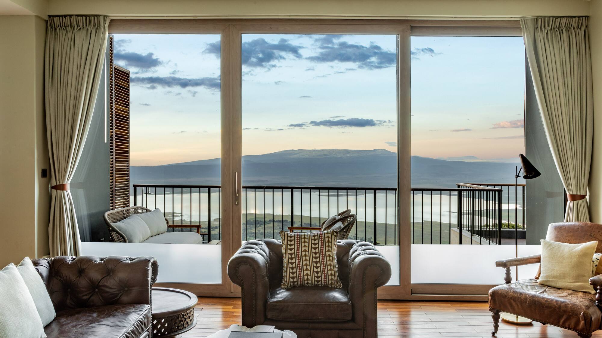 a living room with a view of the ocean