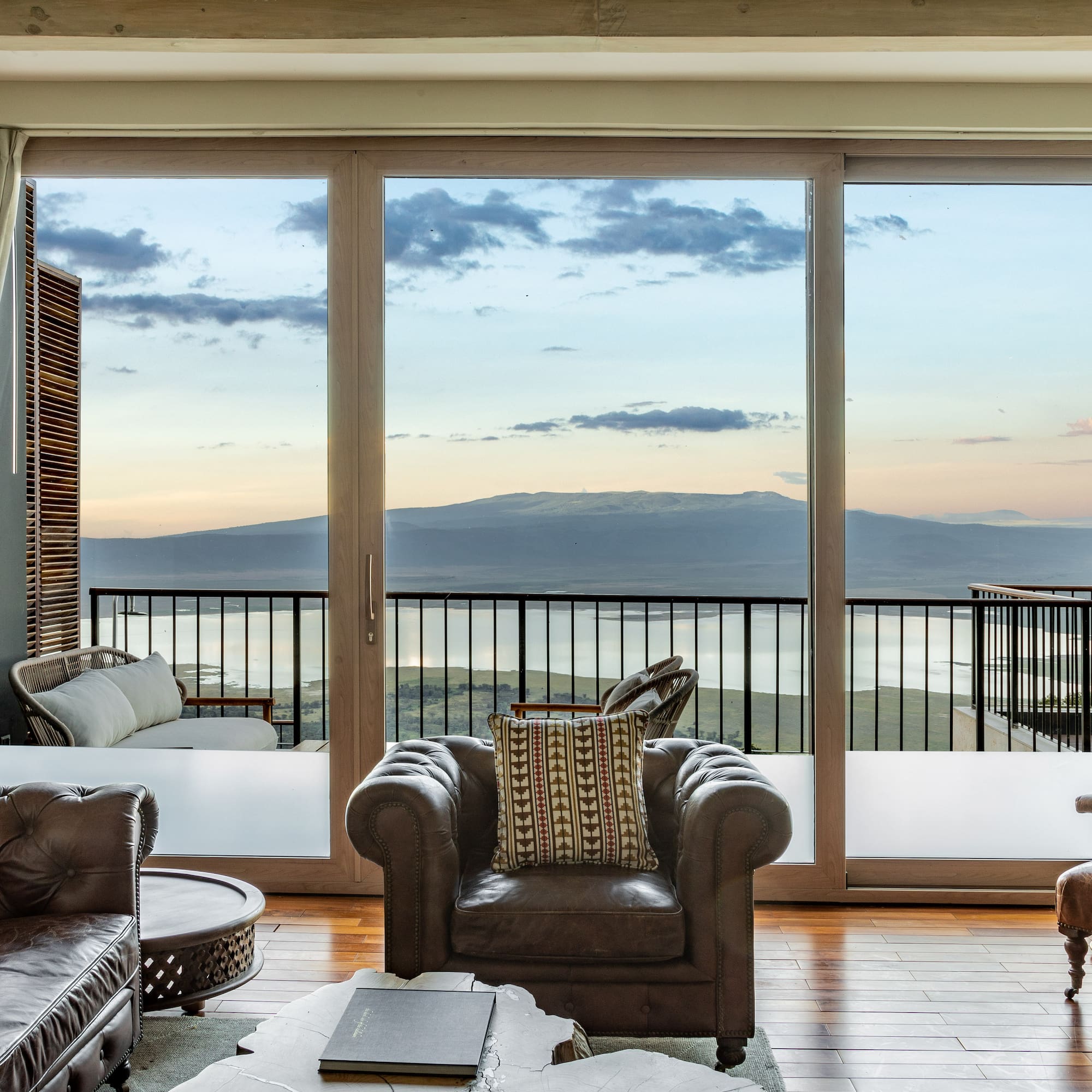 a living room with a view of the ocean