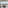 Luxury living room with panoramic mountain and lake views from balcony.