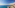 a beach with buildings and palm trees
