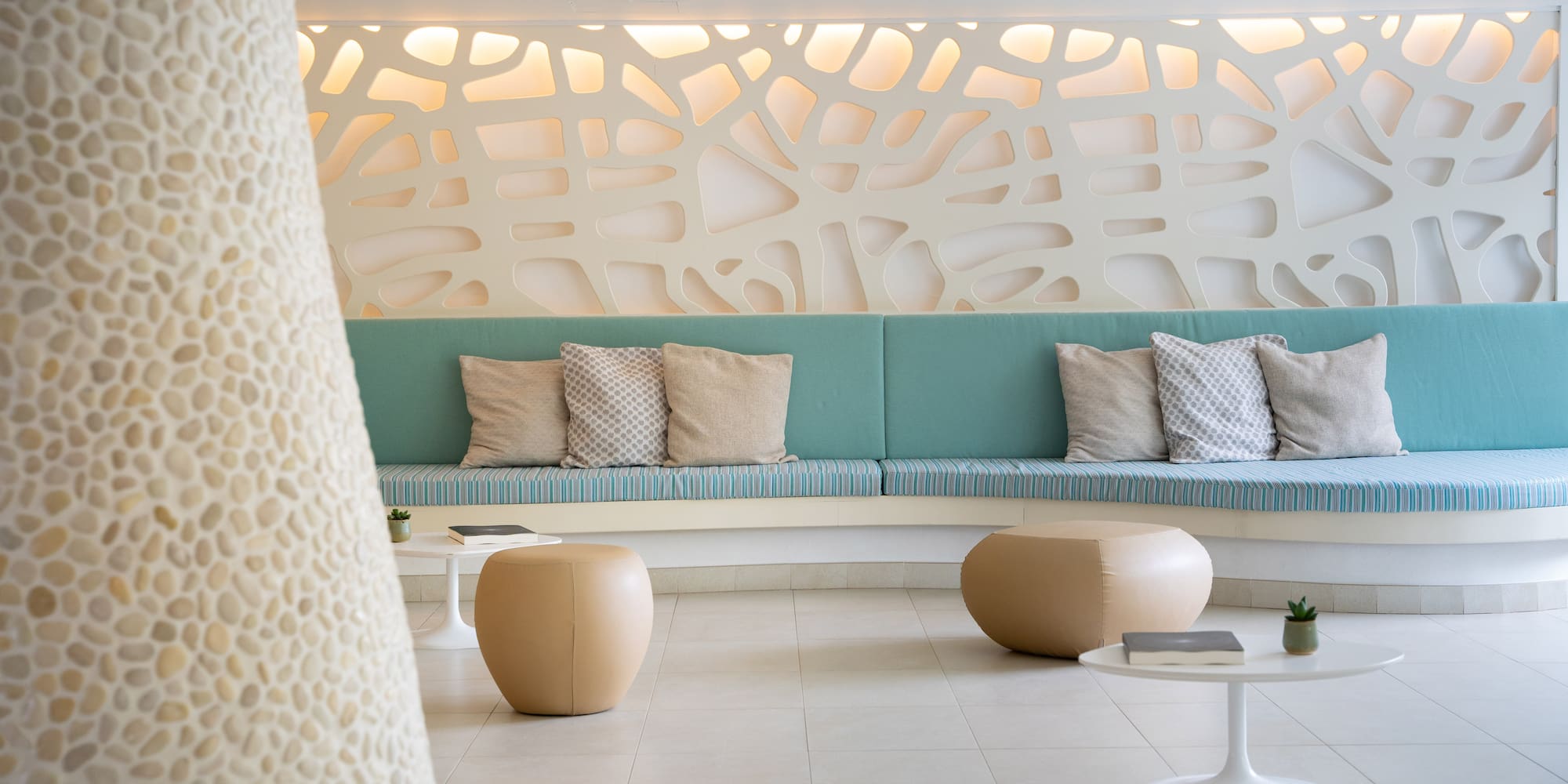 a room with a couch and coffee tables