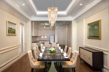 a dining room with a table and chairs