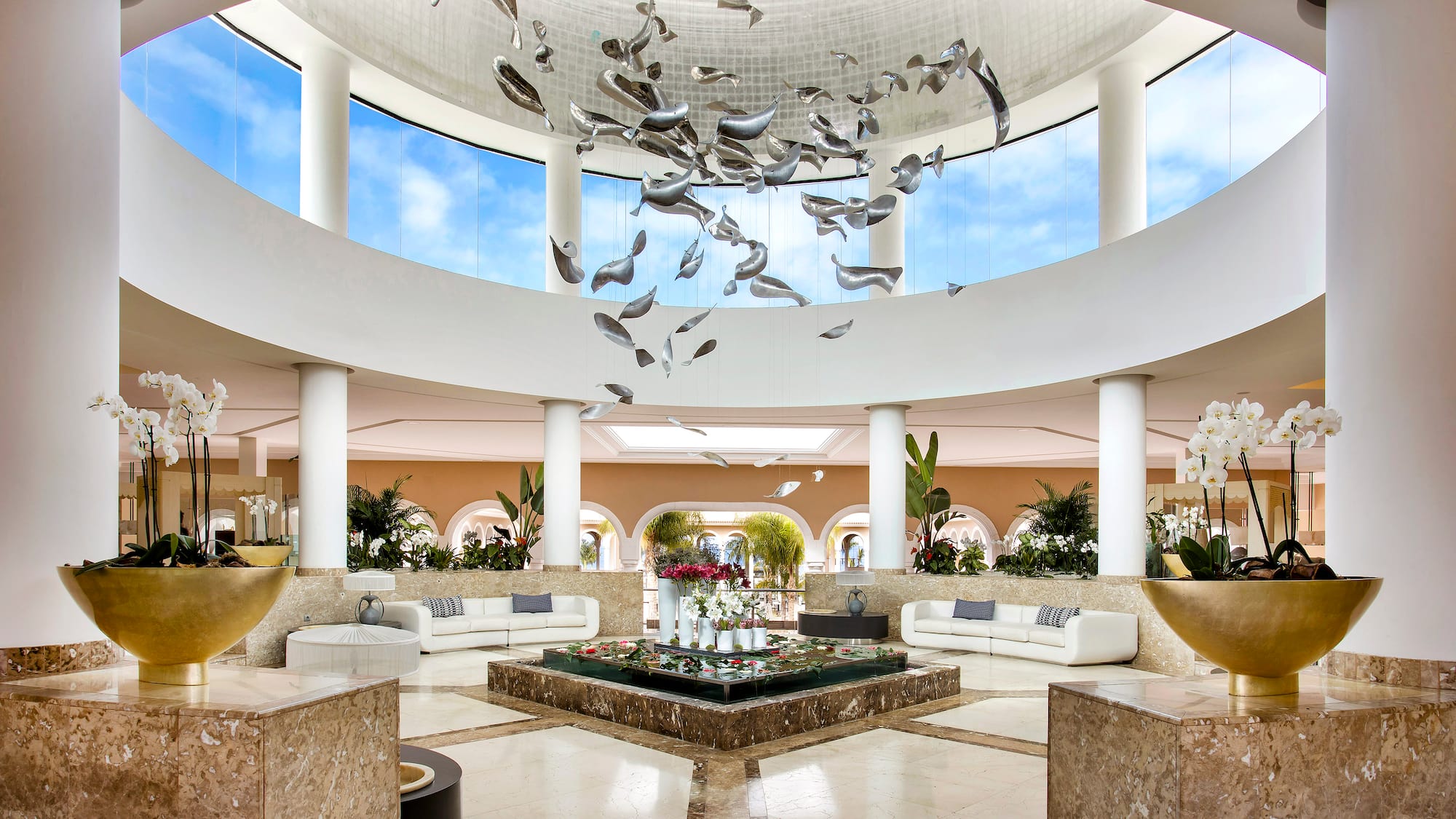 a large room with a large ceiling and a large flower arrangement
