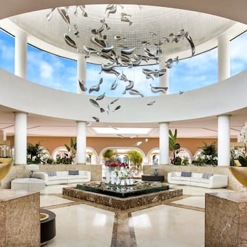 a large room with a large ceiling and a large flower arrangement