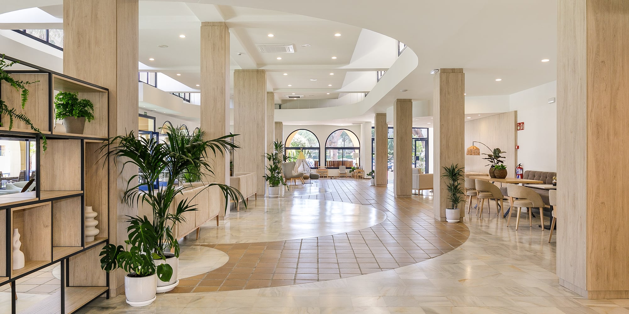 a large room with a large floor and columns