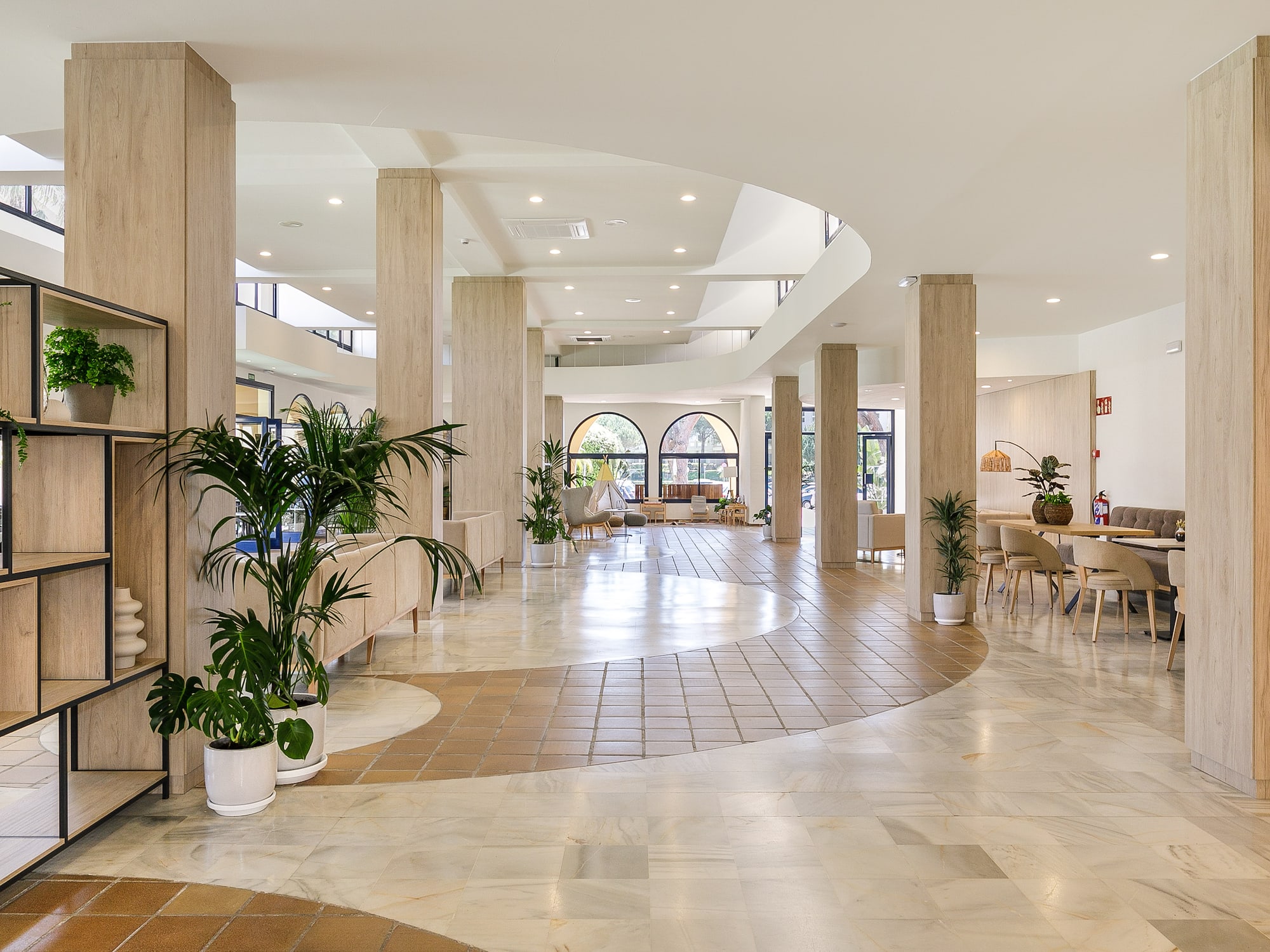 a large room with a large floor and columns